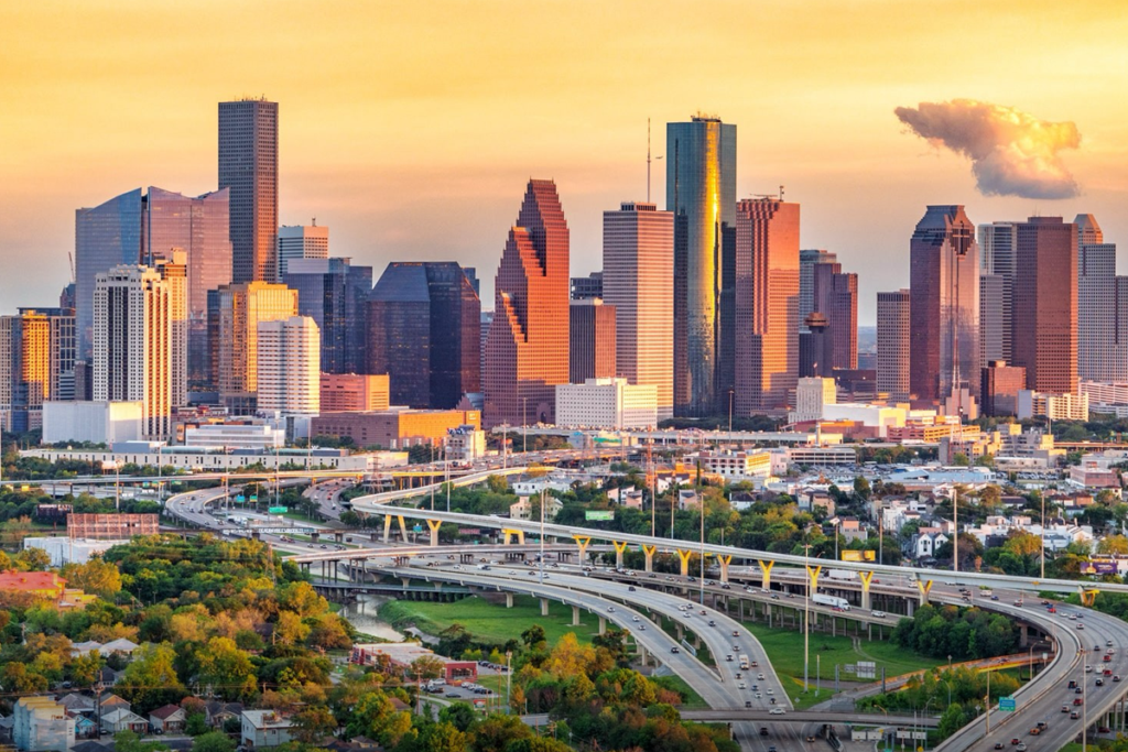 Downtown Houston skyline at sunset, home to commercial buildings that need regular fire sprinkler inspection